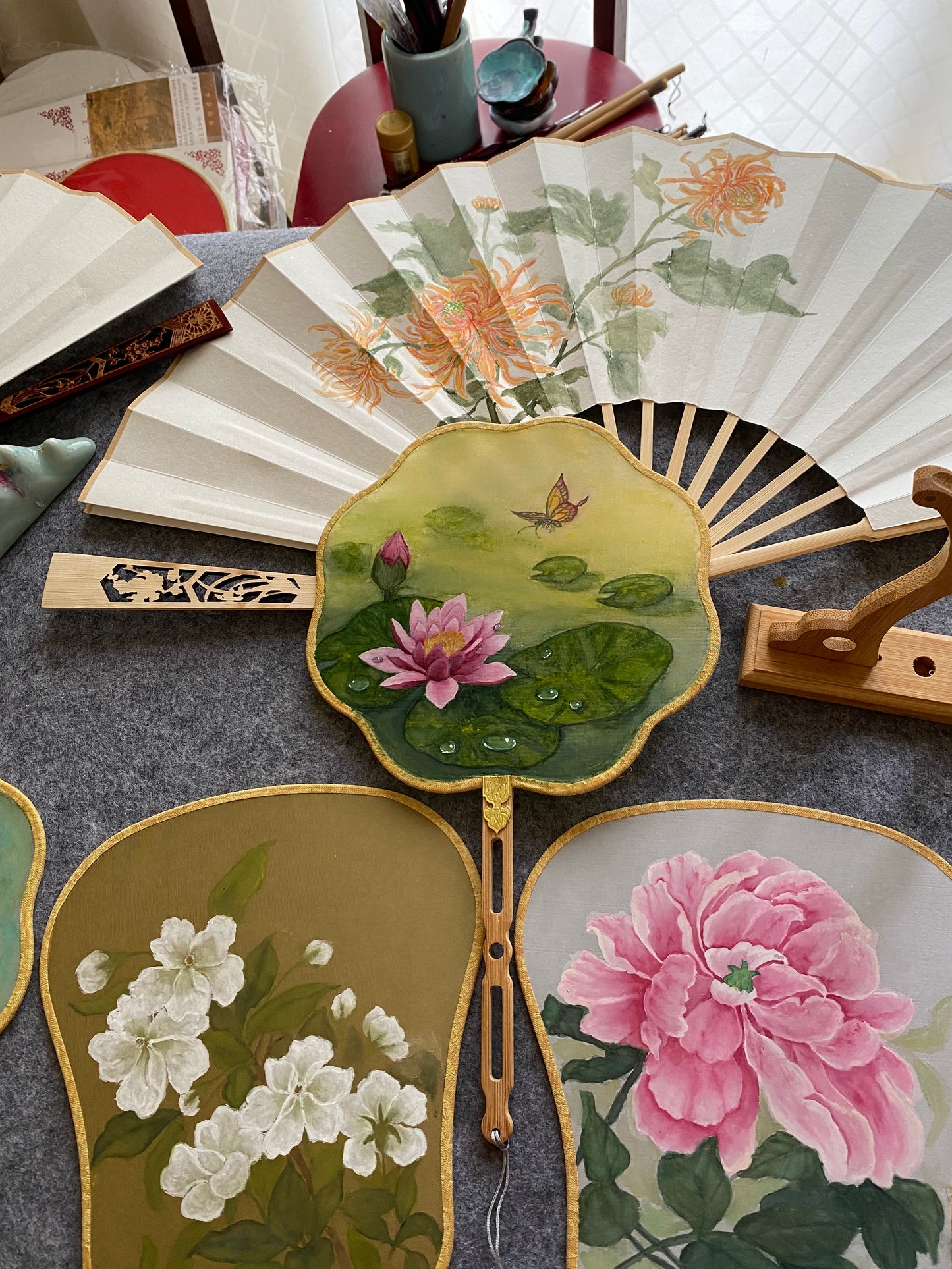 Traditional Chinese brush paintings on silk fans